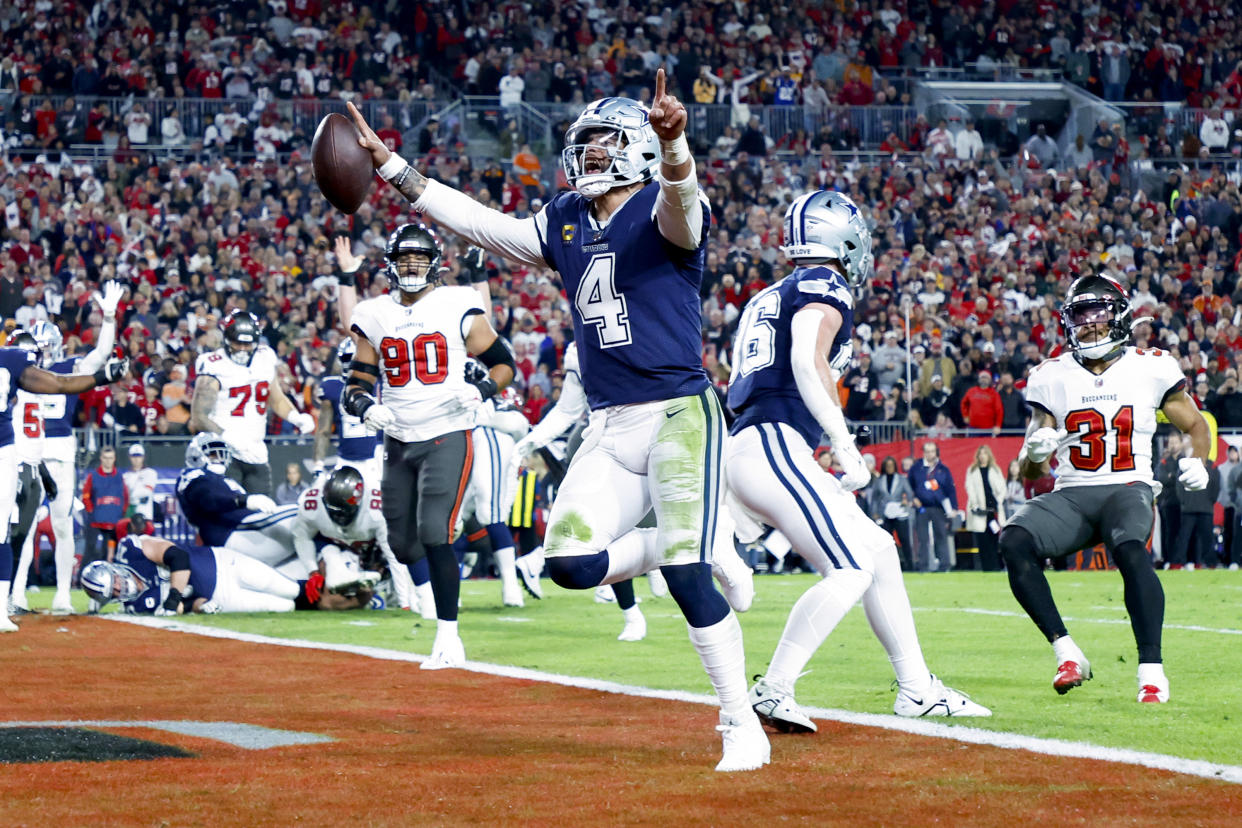 Dak Prescott of the Dallas Cowboys rushes for a touchdown against the Tampa Bay Buccaneers. (Photo by Mike Ehrmann/Getty Images)