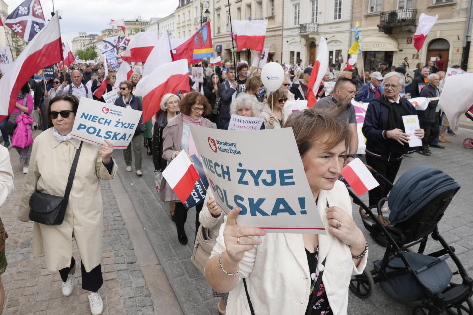 Anti-abortion demonstrators march in support of every conceived life and against steps taken by the new government to liberalize Poland's strict law and allow termination of pregnancy until the 12th week, in Warsaw, Poland, on Sunday, April 14, 2024. Last week, Poland's parliament, which is dominated by the liberal and pro-European Union ruling coalition, voted to approve further detailed work on four proposals to lift the near-ban on abortions. (AP Photo/Czarek Sokolowski)