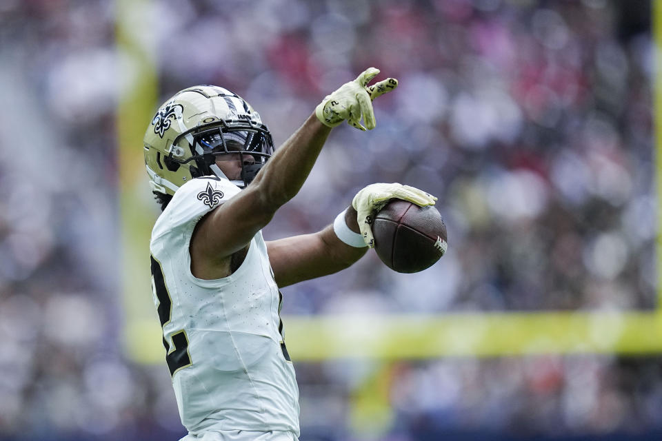 New Orleans Saints wide receiver Chris Olave (12) reacts after a long first down reception in the second half of an NFL football game against the Houston Texans in Houston, Sunday, Oct. 15, 2023. (AP Photo/Eric Gay)