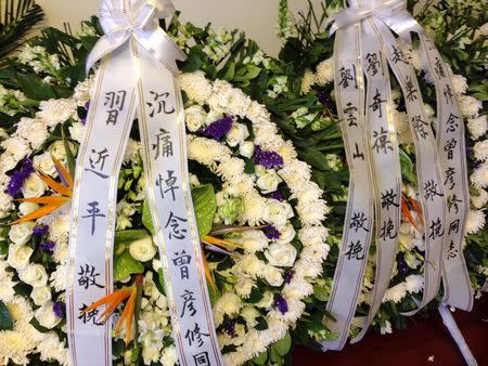 Wreaths sent by Chinese President Xi Jinping to Zeng Yanxiu is seen at Zeng's flat, in Beijing, March 10, 2015. REUTERS/Benjamin Kang Lim