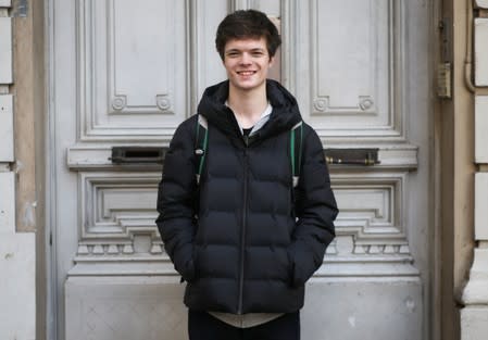 Simon, 17, who voted for the first time in the primary elections, poses in Buenos Aires