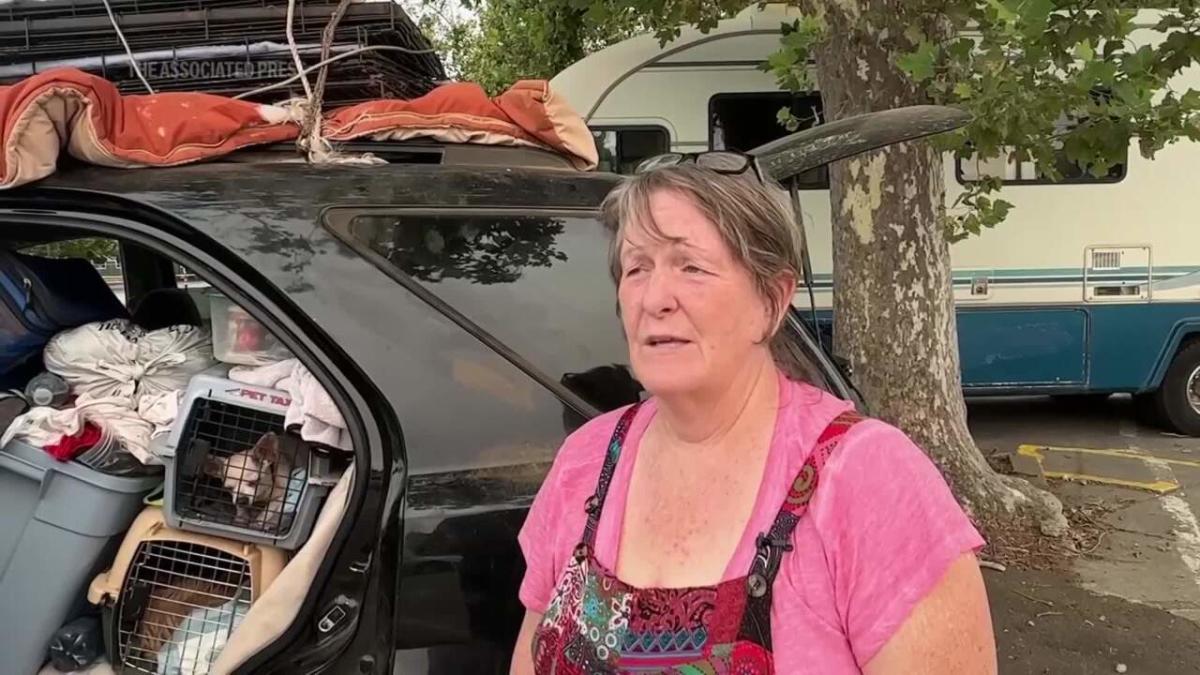 California wildfire evacuee shelters with her 7 dogs