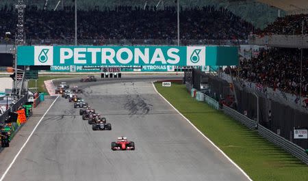 Formula One - F1 - Malaysian Grand Prix 2015 - Sepang International Circuit, Kuala Lumpur, Malaysia - 29/3/15 Ferrari's Sebastian Vettel (bottom) in action during the race Reuters / Olivia Harris