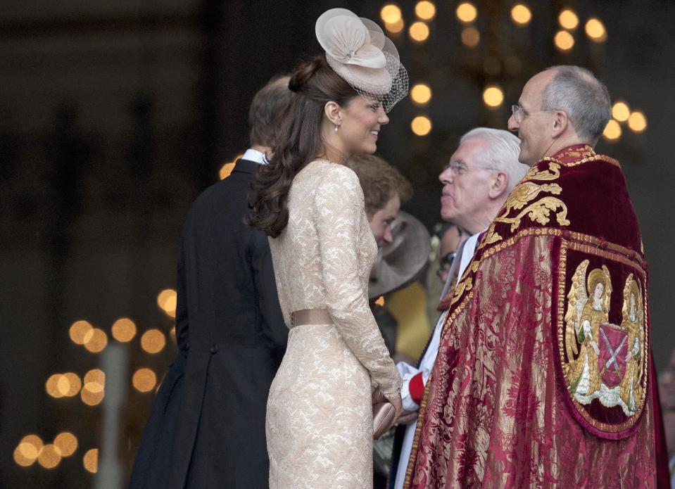 Kate, Duchess of Cambridge talks to religious leaders as she arrives at St Paul's Cathedral for a national service of thanksgiving for the Britain's Queen Elizabeth II and her Queen's Diamond Jubilee in London, Tuesday, June 5, 2012. (AP Photo/Alastair Grant)