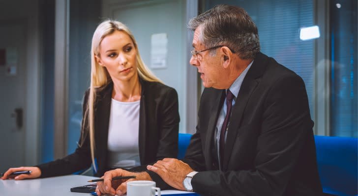 A financial advisor discussing the pros and cons of an immediate annuity with a client.