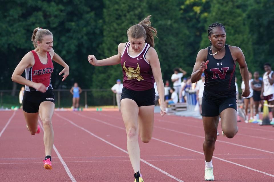 Arlington's Riley Pettigrew, center, and Nyack's Amber McDonald run the 1000-meter dash at the Section 1 state track & field qualifing meet at Suffern Middle School on Thursday, June 1, 2023.