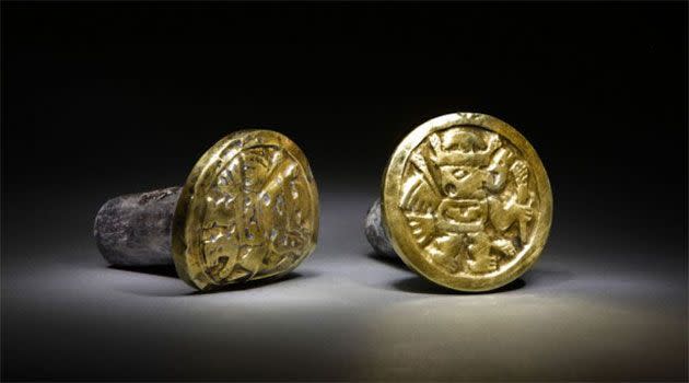 A pair of gold-and-silver ear ornaments that archaeologists believe a high-ranking Wari woman wore to her grave, the imperial tomb at El Castillo funerary complex, where they also discovered the remains of 63 individuals, including three Wari queens in Huarmey, Peru. Photo: Daniel Giannoni/National Geographic/AAP