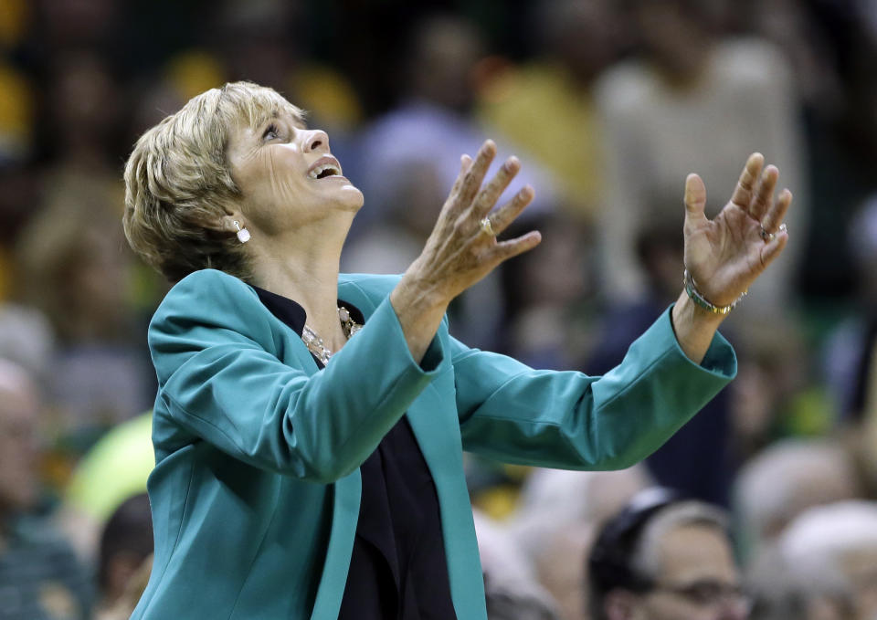 Baylor head coach Kim Mulkey throws her hands up after her team was charged with a foul in the first half of an NCAA college basketball game against Connecticut, Monday, Jan. 13, 2014, in Waco, Texas. (AP Photo/Tony Gutierrez)