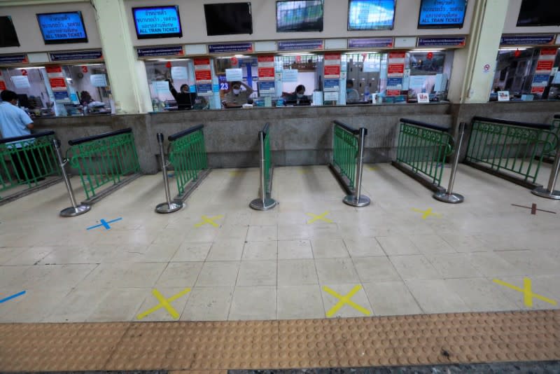 Social distancing marks are seen on the floor of a ticket counter due to coronavirus disease (COVID-19) outbreak, at a train station in Bangkok