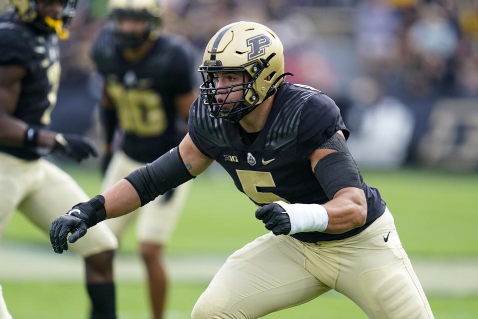 Purdue defensive end George Karlaftis (5) readies to make a tackle against Wisconsin in October.