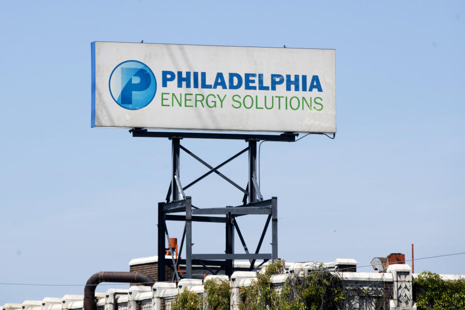 A sign for Philadelphia Energy Solutions stands at the refining complex in Philadelphia, Wednesday, June 26, 2019. The owner of the largest oil refinery complex on the East Coast is telling officials that it will close the facility after a fire last week set off explosions and damaged the facility. Philadelphia Mayor Jim Kenney said in a statement Wednesday that Philadelphia Energy Solutions had informed him of its decision to shut down the facility in the next month. The more than 1,000 workers there will be impacted, the mayor said. (AP Photo/Matt Rourke)