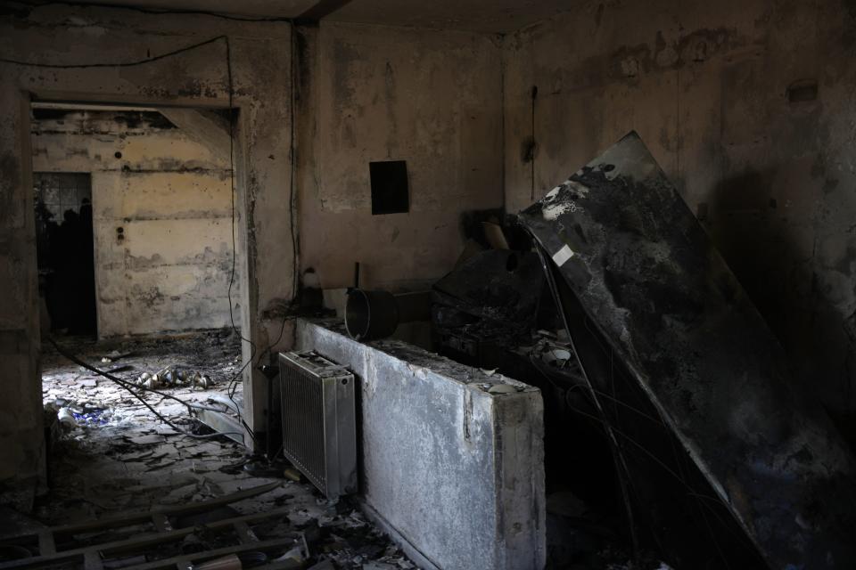 The interior of a burnt house in Acharnes suburb, on Mount Parnitha, in northwestern Athens, Greece, Thursday, Aug. 24, 2023. A major wildfire burning on the northwestern fringes of the Greek capital has torched homes and is now threatening the heart of a national park of Parnitha, one of the last green areas near the Greek capital. (AP Photo/Thanassis Stavrakis)