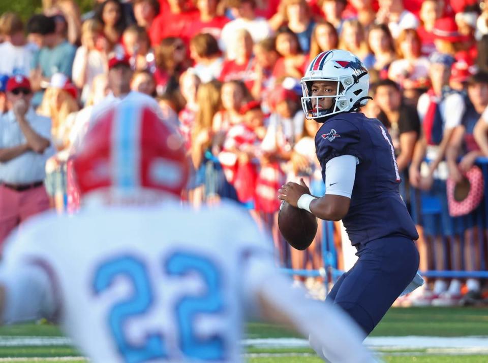 Providence Day quarterback Jadyn Davis drops back to pass to a receiver during first half action against Charlotte Catholic on Friday, September 1, 2023 at Providence Day School.
