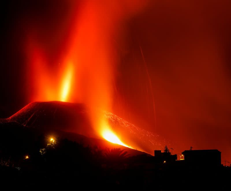 Lava and smoke rise following the eruption of a volcano on the Canary Island of La Palma