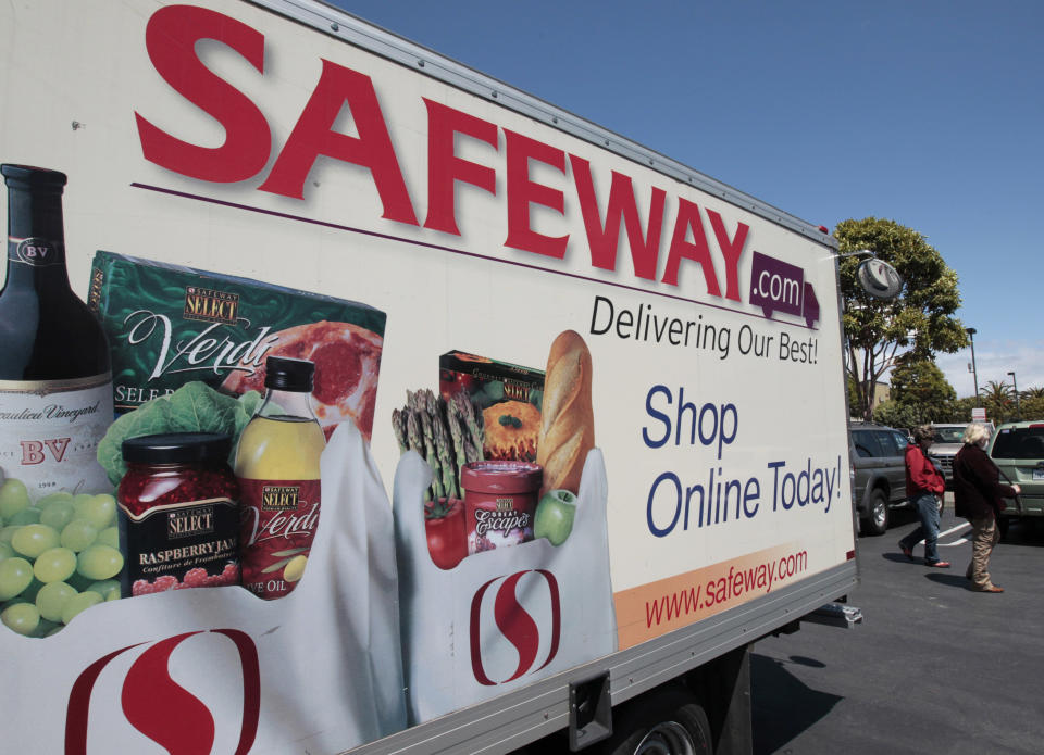 FILE- In this Thursday, April 26, 2012, file photo, a Safeway online shopping advertisement is shown at a Safeway store in San Francisco. Safeway Inc. said Thursday, July 19, 2012, that its net income fell 16 percent in the second quarter, as the grocery store operator spent more on advertising and fought to hold onto customers amid growing competition. (AP Photo/Paul Sakuma, File)