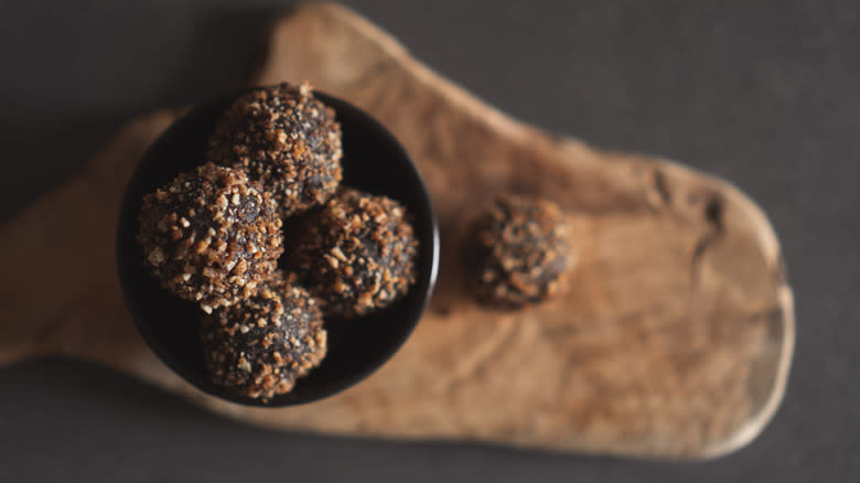 Bourbon balls in a black bowl