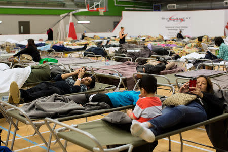 Fort McMurray residents rest at a community centre in Anzac, Alberta, after residents were ordered to be evacuated due to a raging wildfire, May 4, 2016. REUTERS/Topher Seguin