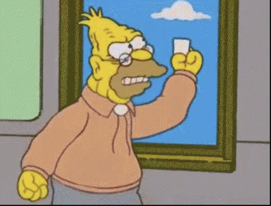 Grandpa Simpson from 'The Simpsons' animated series is waving a piece of paper