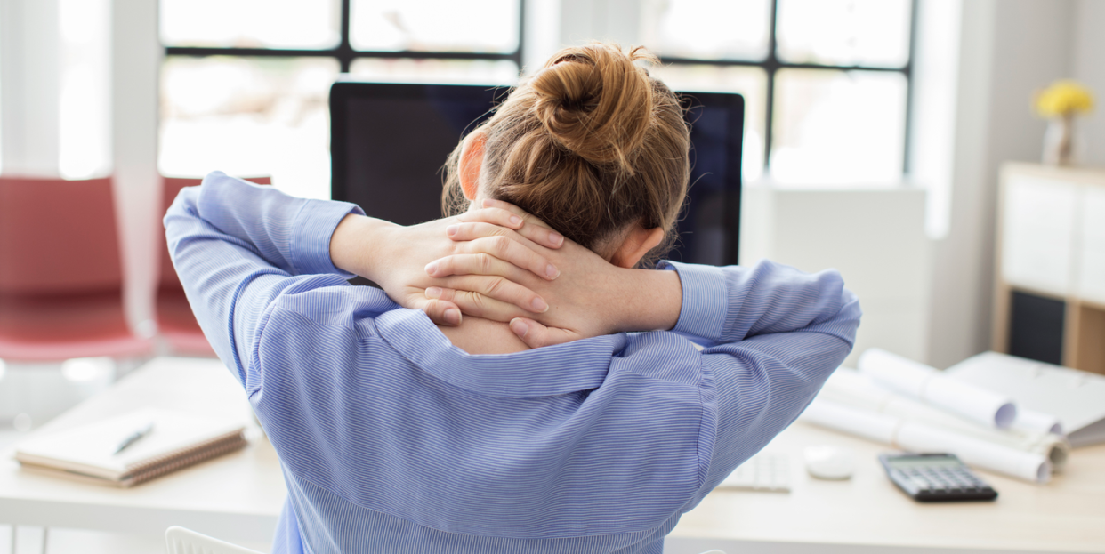 woman neck pain at desk