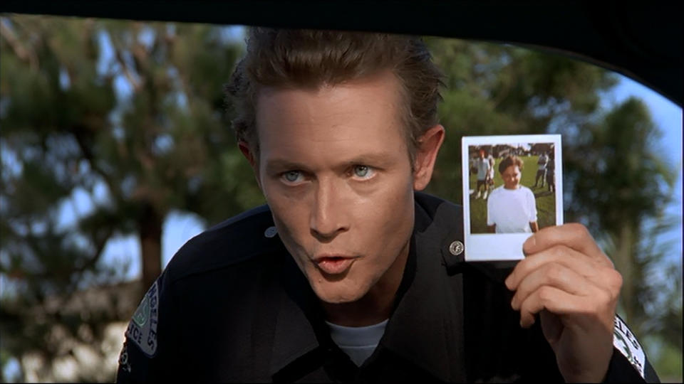 <p>It’s one of the greatest movie cameos of all time, and it makes absolutely no sense, but just go with it. Wayne is pulled over in his Mirth-Mobile and asks the approaching officer if he’s done anything wrong. The cop leans into the window and it’s none other than Robert Patrick aka ‘Terminator 2”s T-1000, complete with a photo: “Have you seen this boy?” Wayne screams and drives away as fast as he can. Is this, like, Terminator canon? (Credit: Paramount Pictures) </p>