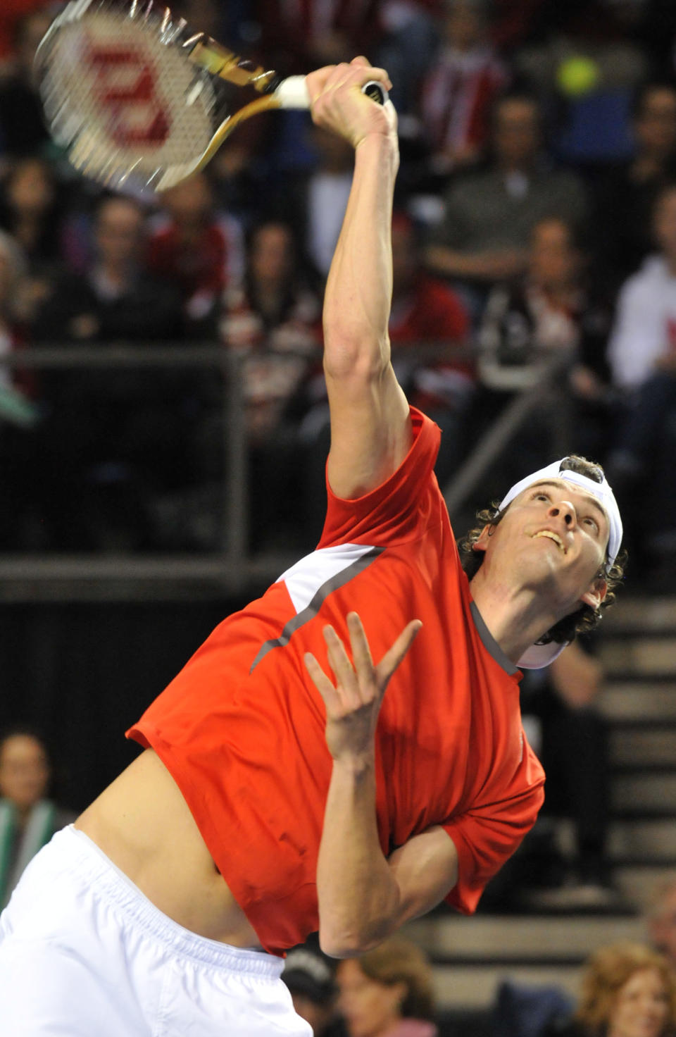 Frank Dancevic of Canada serves against Jo-Wilfried Tsonga of France during Davis Cup action in Vancouver, BC, on February 12, 2012. Tsonga defeated Dancevic 6-4, 6-4, 6-1. AFP PHOTO / Don MacKinnon (Photo credit should read Don MacKinnon/AFP/Getty Images)