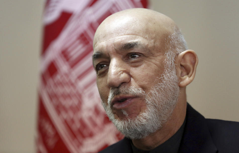 Former Afghan President Hamid Karzai speaks during an interview with The Associated Press in Kabul, Afghanistan, Saturday, Feb. 16, 2019. Karzai expressed fears that a previously unscheduled meeting between the Taliban and the United States in Pakistan on Monday risks engulfing Afghanistan into regional rivalries, as its neighbors and powerful Persian Gulf states jockey for influence in a post- U.S. Afghanistan. (AP Photo/Rahmat Gul)