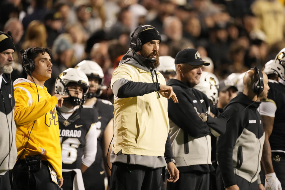 FILE - Colorado offensive coordinator Sean Lewis gestures in the second half of an NCAA college football game, Nov. 4, 2023, in Boulder, Colo. Lewis, who was stripped of his play-calling duties as Colorado's offensive coordinator late in the season, is being hired as head coach at San Diego State, a person with knowledge of the situation said Tuesday, Nov. 28. (AP Photo/David Zalubowski, File)