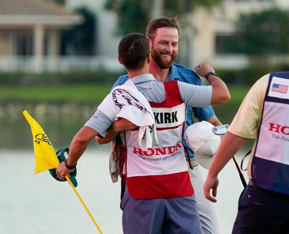 Chris Kirk and his caddie Michael Cromie celebrate his playoff victory in the Honda Classic at PGA National Resort & Spa on Sunday, February 26, 2023, in Palm Beach Gardens, FL.
