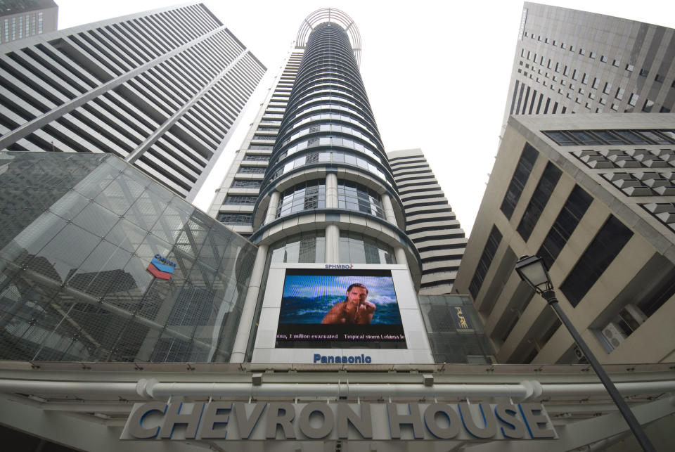 SINGAPORE - OCTOBER 08:  The Chevron House building stands in the central business district of Singapore, on Monday, Oct. 8, 2007. Singapore's economy probably extended its longest expansion in 16 years, as growth in the island's manufacturing and construction industries countered any fallout from turmoil in global financial markets.  (Photo by Stefen Chow/Bloomberg via Getty Images)