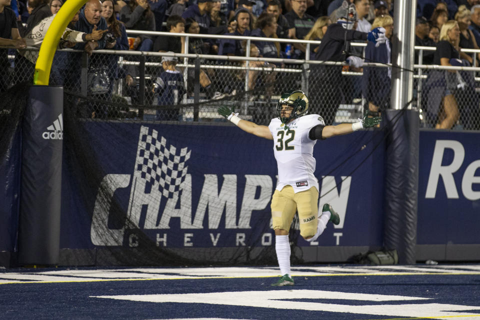 Colorado State defensive back Ayden Hector (32) celebrates after returning an interception for a touchdown against Nevada during the first half of an NCAA college football game in Reno, Nev., Friday, Oct. 7, 2022. (AP Photo/Tom R. Smedes)