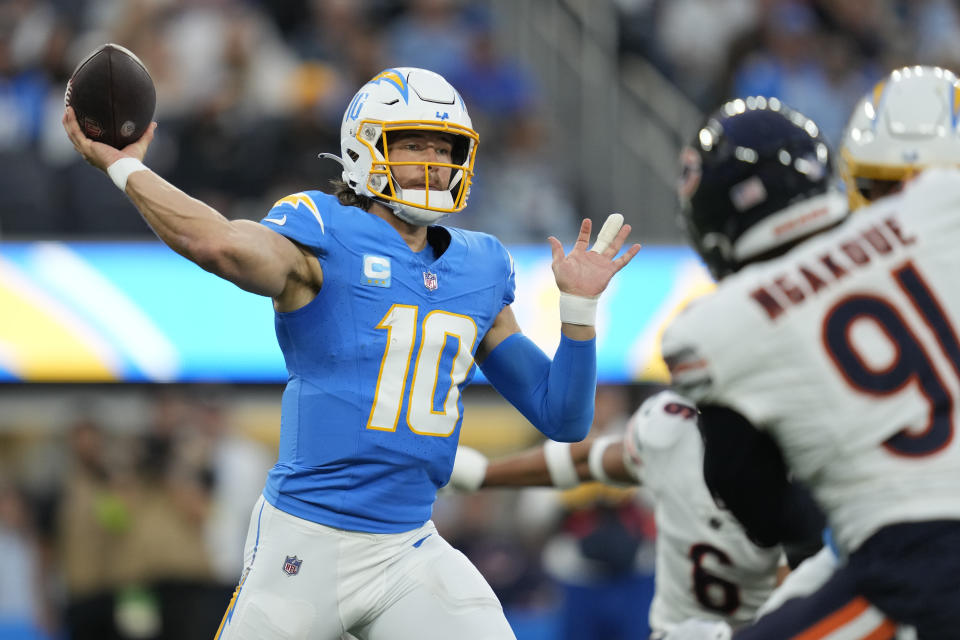 Los Angeles Chargers quarterback Justin Herbert throws a pass during the first half of an NFL football game against the Chicago Bears, Sunday, Oct. 29, 2023, in Inglewood, Calif. (AP Photo/Ashley Landis)