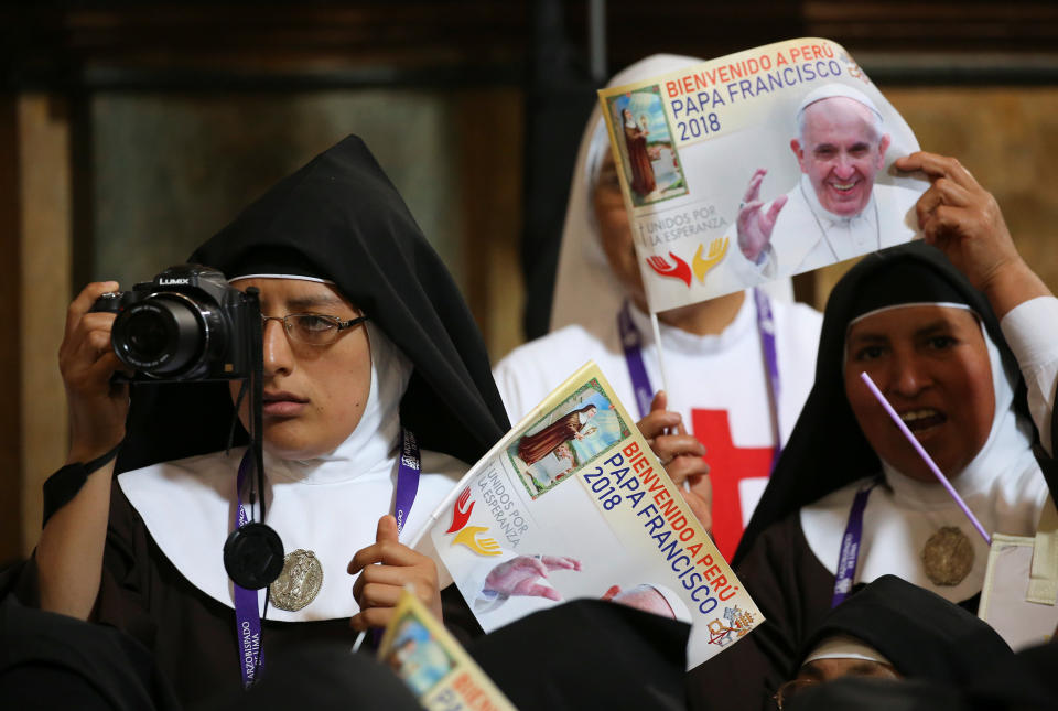 A nun snapped a photo of Pope Francis during his speech in Lima on Sunday. (Photo: Getty/Alessandro Bianchi)