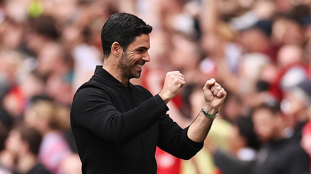 Arsenal manager Mikel Arteta pumps his fists in celebration at his side scoring against Bournemouth in the English Premier League. 