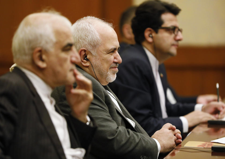 Iranian Foreign Minister Mohammad Javad Zarif, center, meets with Chinese Foreign Minister Wang Yi (not pictured) at the Diaoyutai State Guesthouse in Beijing, Aug. 26, 2019. (How Hwee Young/Pool Photo via AP)