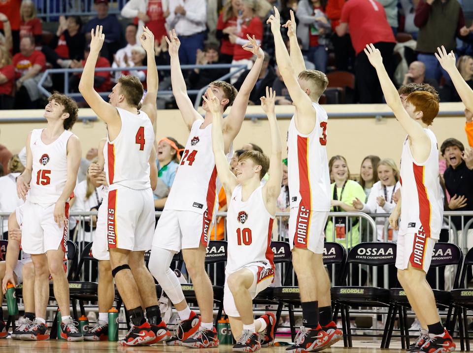 Dale's bench celebrates after a basket against Wister during Tuesday's Class 2A state tournament quarterfinal game at State Fair Arena.