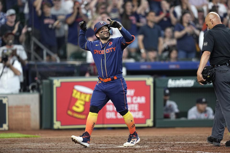 Houston Astros' Jose Altuve celebrates after hitting a grand slam against the Minnesota Twins during the seventh inning of a baseball game Monday, May 29, 2023, in Houston. (AP Photo/David J. Phillip)