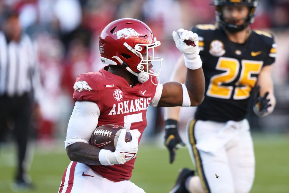 Nov 26, 2021; Fayetteville, Arkansas, USA; Arkansas Razorbacks ruling back Raheim Sanders (5) runs the ball during the second quarter against the Missouri Tigers at Donald W. Reynolds Razorbacks Stadium. Mandatory Credit: Nelson Chenault-USA TODAY Sports