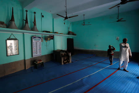 Loud speakers are seen kept inside a mosque as a Muslim man talks to a reporter in Nayabans village in Bulandshahr district, Uttar Pradesh, India December 5, 2018. REUTERS/Adnan Abidi