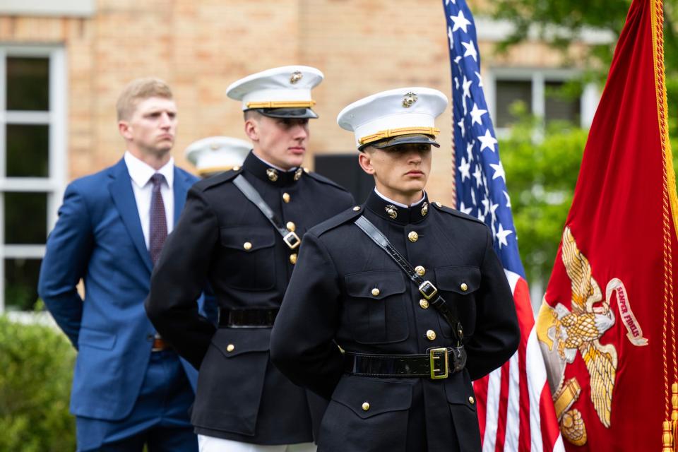 Marine Corps 2nd Lts. Tomasz Ignatik and Joseph Randolph's stand at the position of parade rest during a commissioning ceremony Saturday at Hillsdale College.