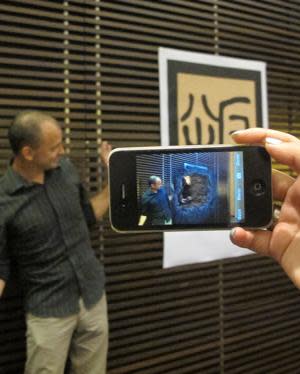 Magma Studios' Chris Jones demonstrates the augmented reality function of the app.