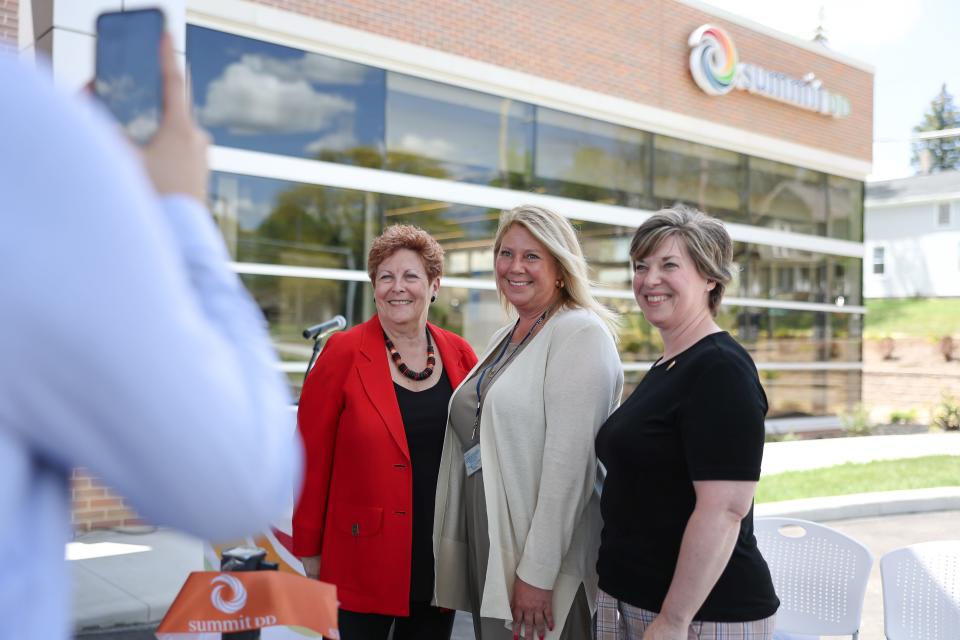 Summit County Developmental Disabilities Board Superintendent Lisa Kamlowsky, center, was joined by County Executive Ilene Shapiro, left, and Cuyahoga Falls Superintendent of Parks and Recreation Sara Kline, representing Mayor Don Walters, at the ribbon cutting ceremony for Summit DD's Cuyahoga Falls location.