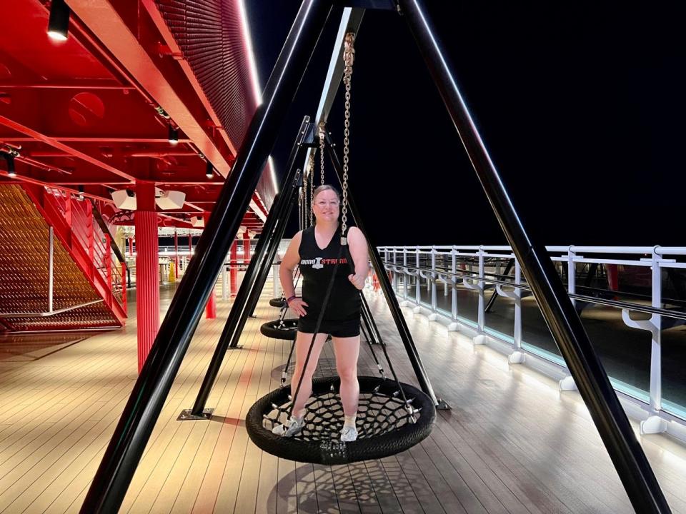 Author Lauren Mack on a bungee swing during a fitness class on Virgin Voyages