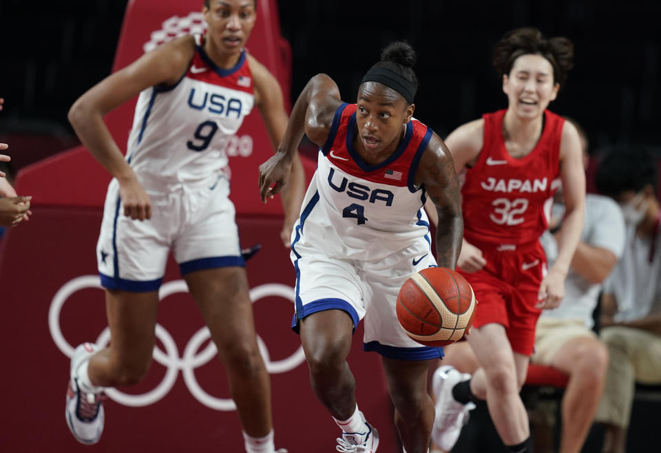 United States' Jewell Loyd (4), center, brings the ball upcourt during women's basketball preliminary round game against Japan at the 2020 Summer Olympics, Friday, July 30, 2021, in Saitama, Japan. (AP Photo/Eric Gay)