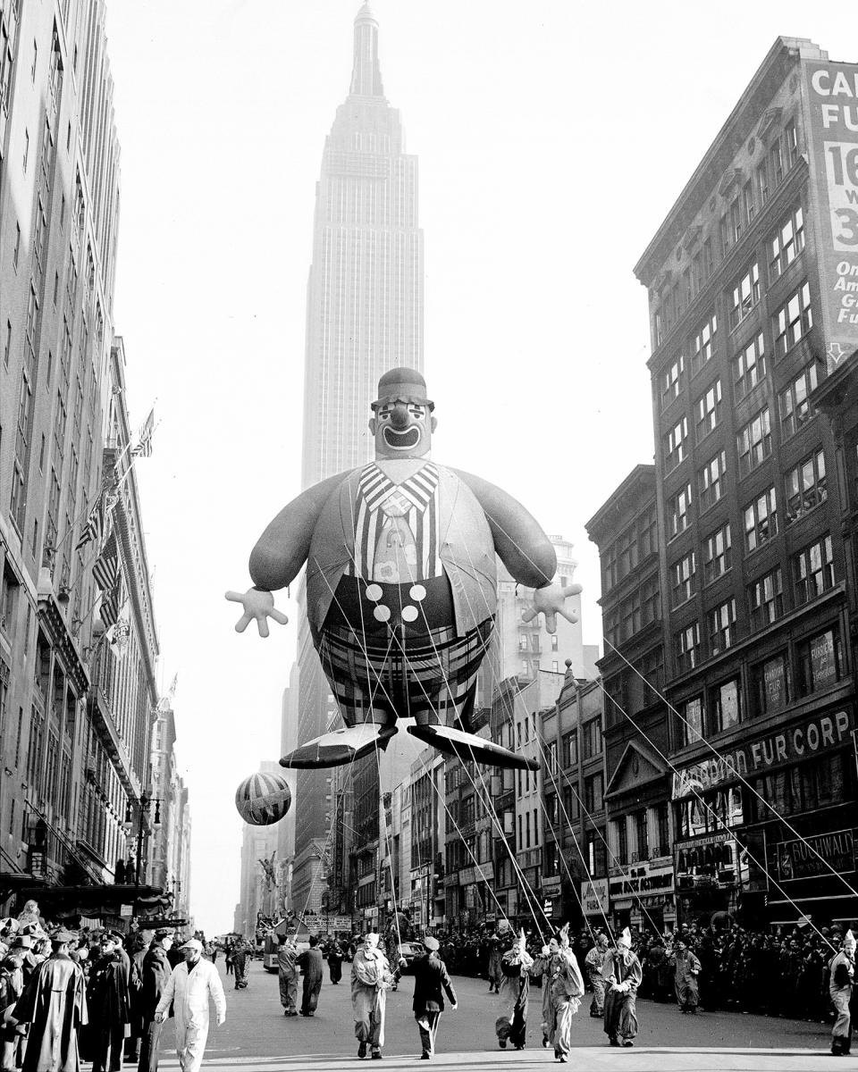 Empire State Building forms a background for this helium-filled clown floating along 34th Street in Macy Parade in 1945. (Photo: Art Whittaker/New York Daily News Archive via Getty Images)