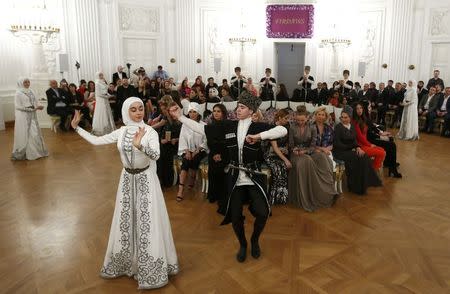 Dancers perform during a show of the Firdaws fashion house led by Aishat Kadyrova, daughter of the Chechen Republic head Ramzan Kadyrov, at the Mercedes-Benz Fashion Week Russia in Moscow, Russia, March 17, 2017. REUTERS/Sergei Karpukhin