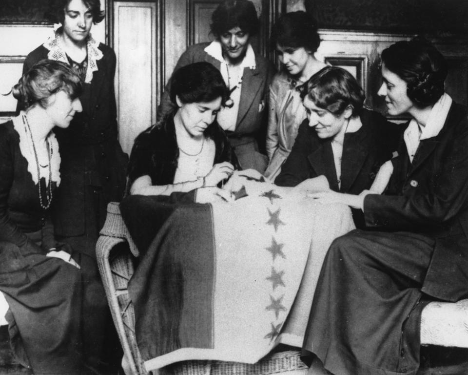 FILE - In this August 1920 file photo, Alice Paul, seated second from left, sews the 36th star on a banner, celebrating the ratification of the women's suffrage amendment. The banner flew in front of headquarters of the Women's Party in Washington of which Miss Paul was national chairperson. The 36th star represented Tennessee, whose ratification completed the number of states needed to put the amendment in the Constitution. (AP Photo)