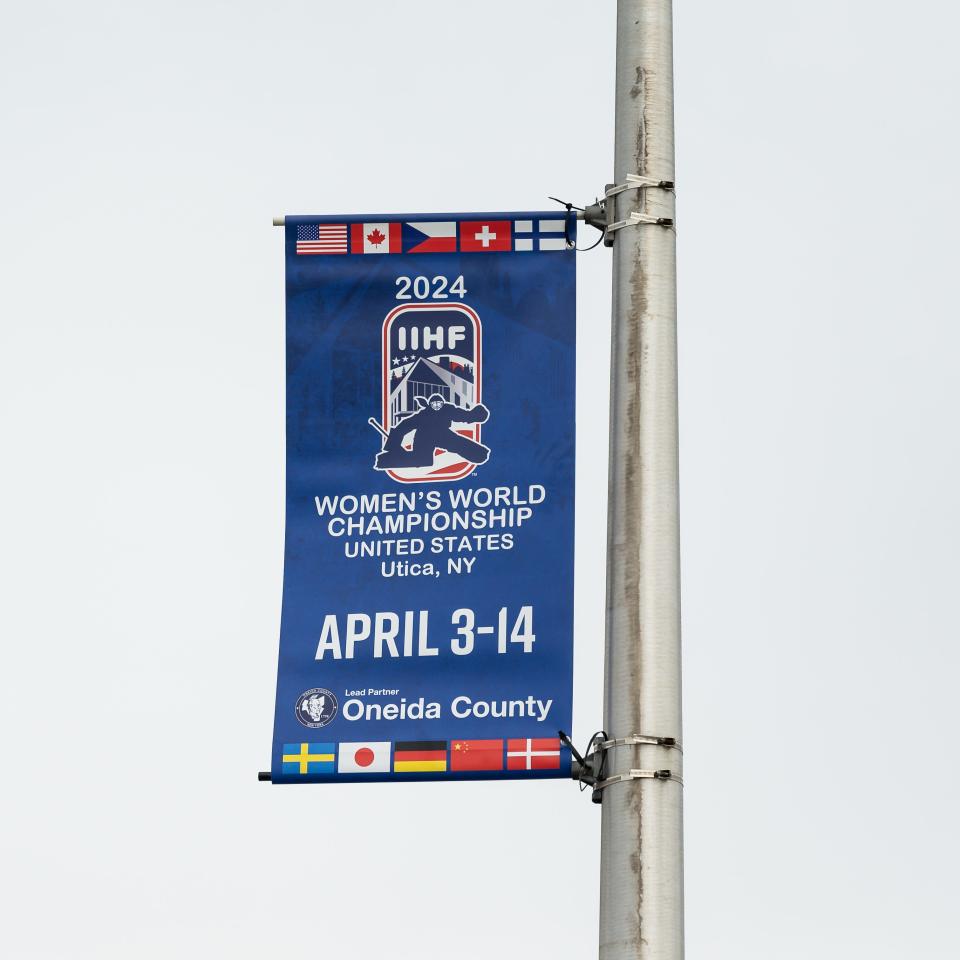 A banner pomoting the IIHF Women's World Hockey Championship in Utica welcomes visitors to the Adirondack Bank Center.