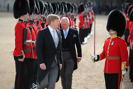 King Willem-Alexander of the Netherlands and Briain's Prince Charles, review the Honour Guard during a ceremonial welcome at the start of a state visit at Horse Guards Parade, in London, Britain October 23, 2018. Christopher Furlong/Pool via REUTERS