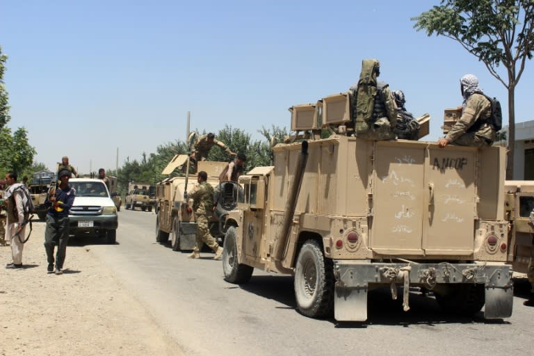 Afghan security personnel prepare for an operation against Taliban militants in Kunduz province on May 31, 2016