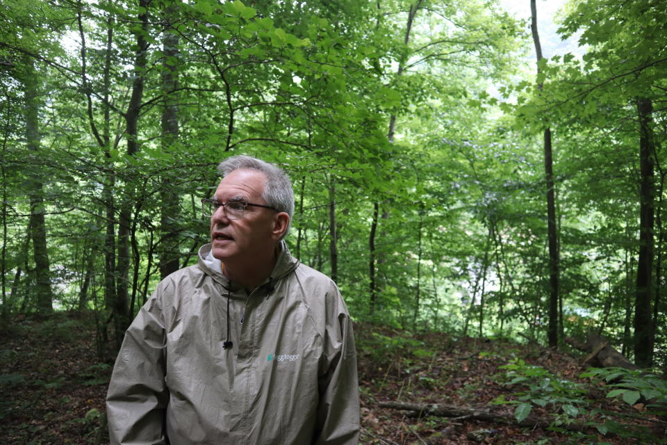 Ed Evans, Democratic West Virginia delegate and retired public school teacher, speaks about the more than 80 coal miners killed in the 1912 Jed Coal and Coke Company explosion during a visit to the unmarked gravesite where disaster victims are buried in Havaco, W.Va, on June 7, 2022. (AP Photo/Leah Willingham)